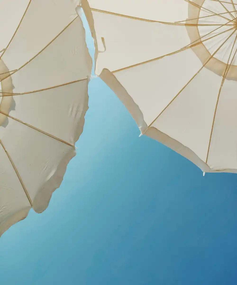 parasoller på blå himmel - blog på Gladhud