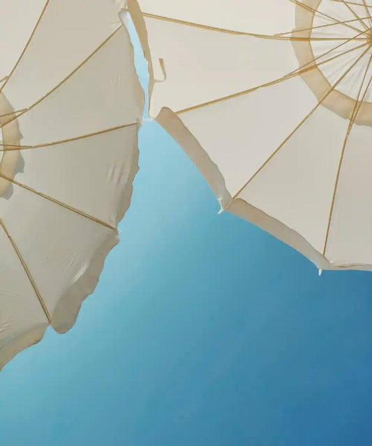 parasoller på blå himmel - blog på Gladhud