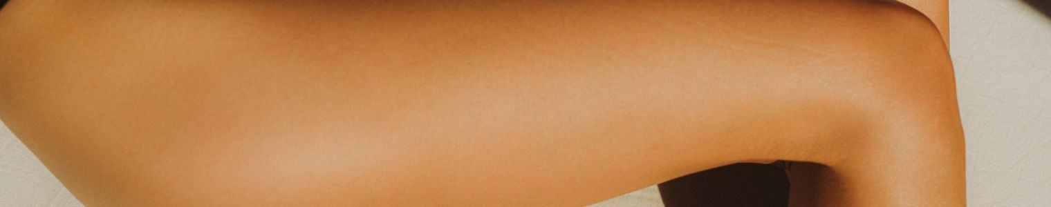 badeolier og renseprodukter - billede af et ben